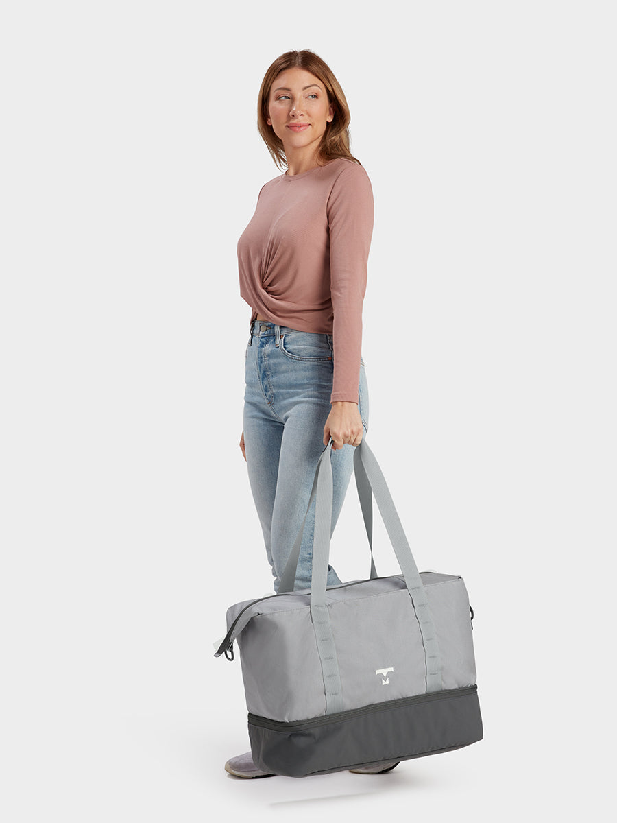 MILTHREAD Canyon 33L travel tote in silver dust on model