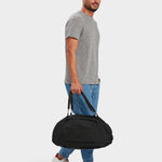 MILTHREAD Grit Duffel 25L travel bag in black on model