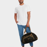 MILTHREAD Grit Duffel 25L travel bag in multicam black on model