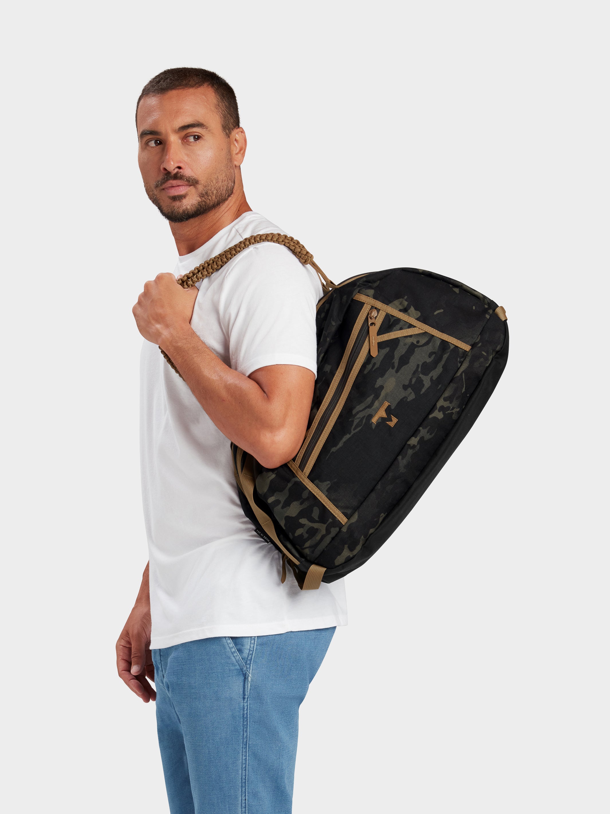 MILTHREAD Grit Duffel 25L travel bag in multicam black on model