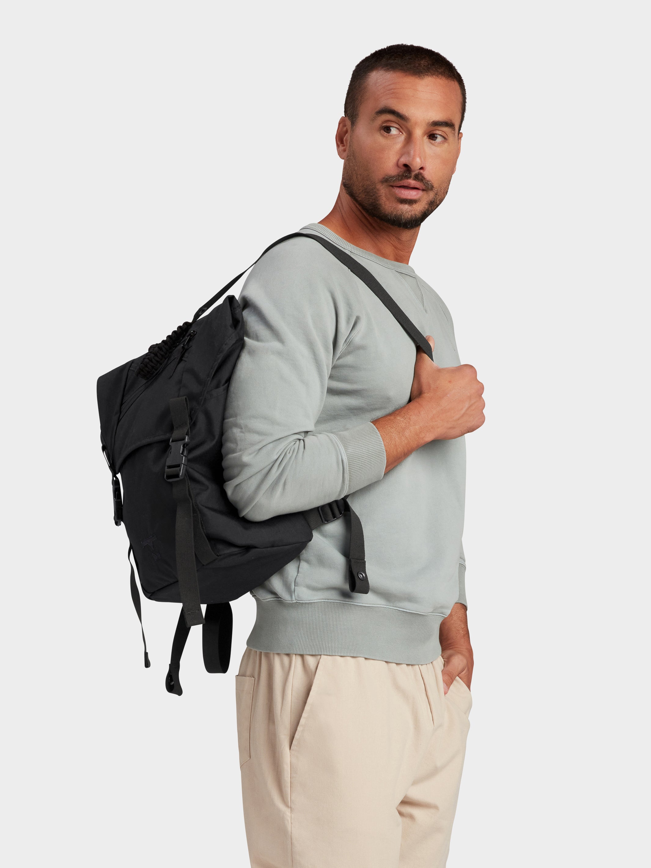 MILTHREAD Swift flap backpack in Black on model