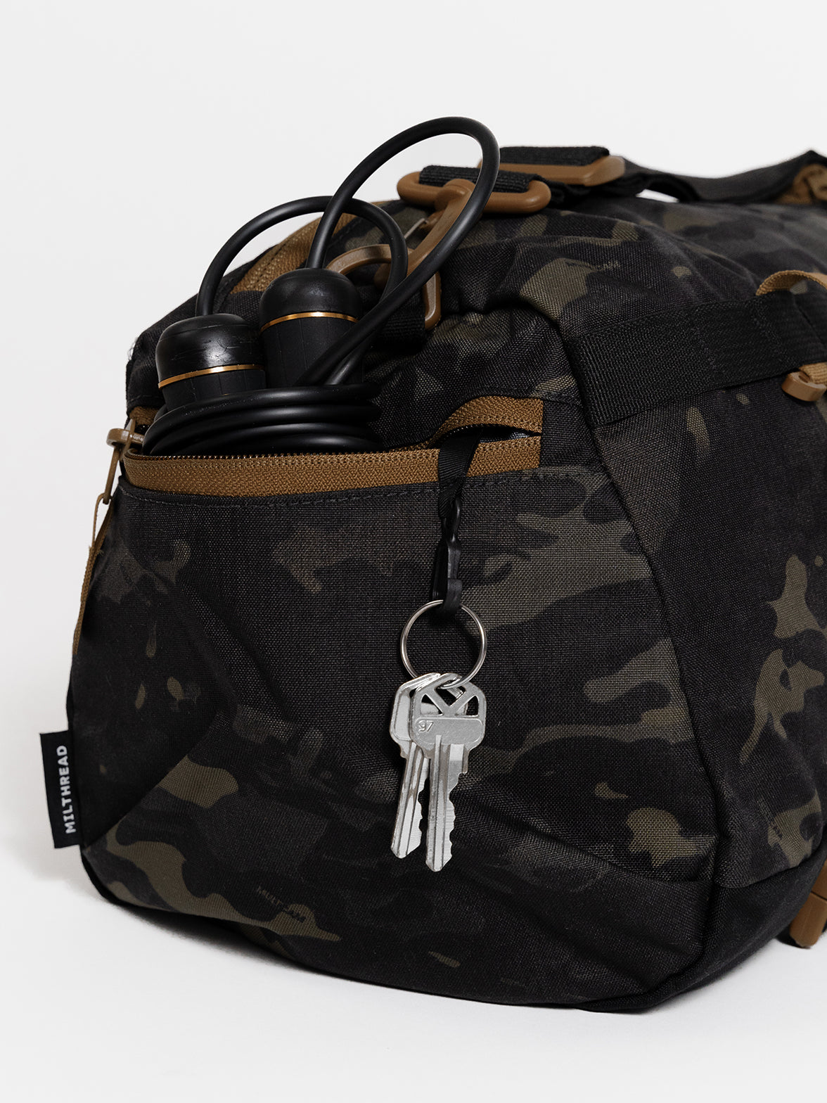 MILTHREAD Athena small duffel bag 15L features side zippered pocket with key clip