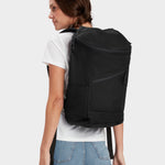 Bold backpack in black carried by model