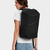 Bold backpack in black carried by model