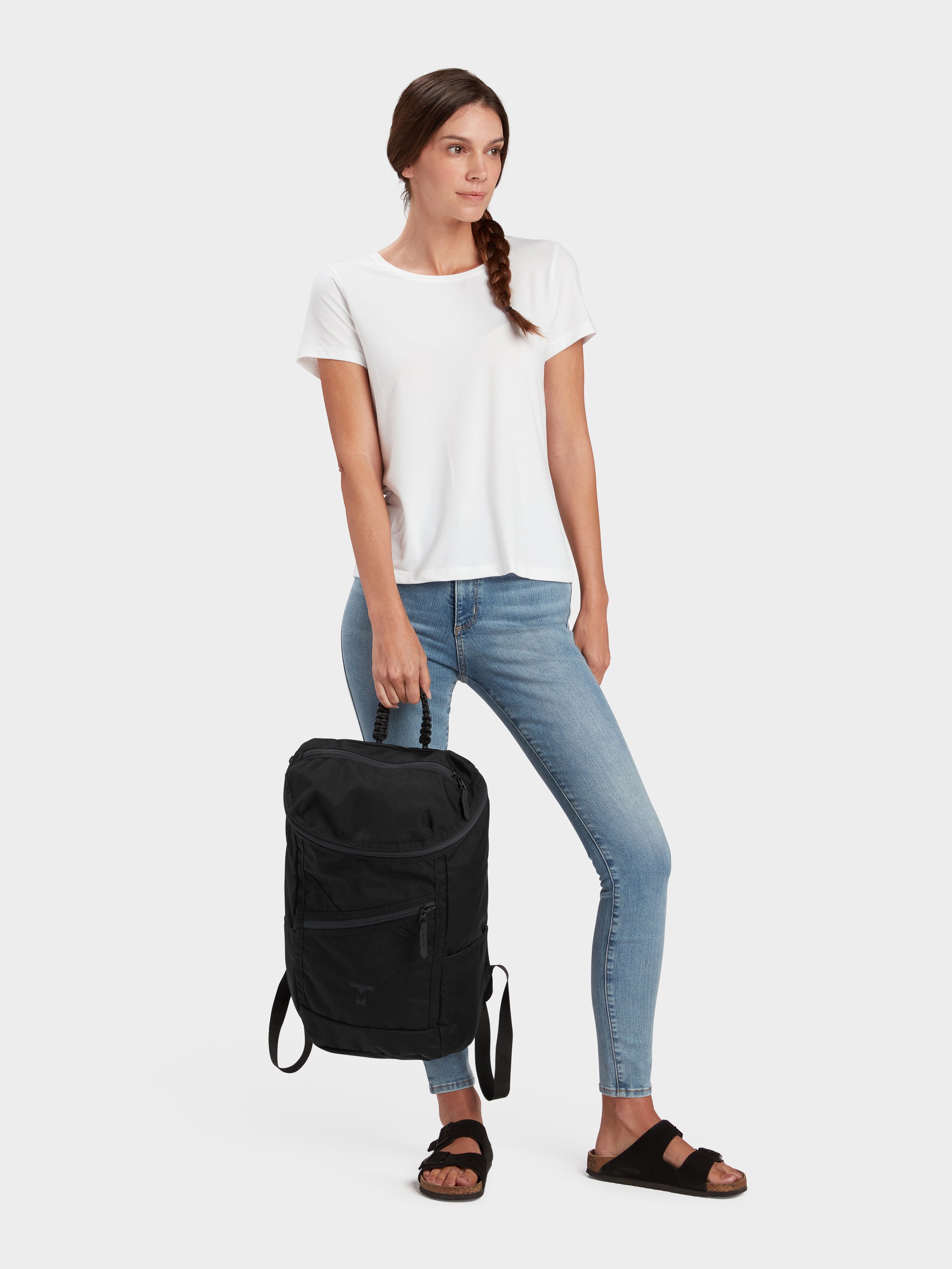 Bold backpack in black carried by model