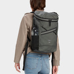 Bold backpack in foliage carried by model