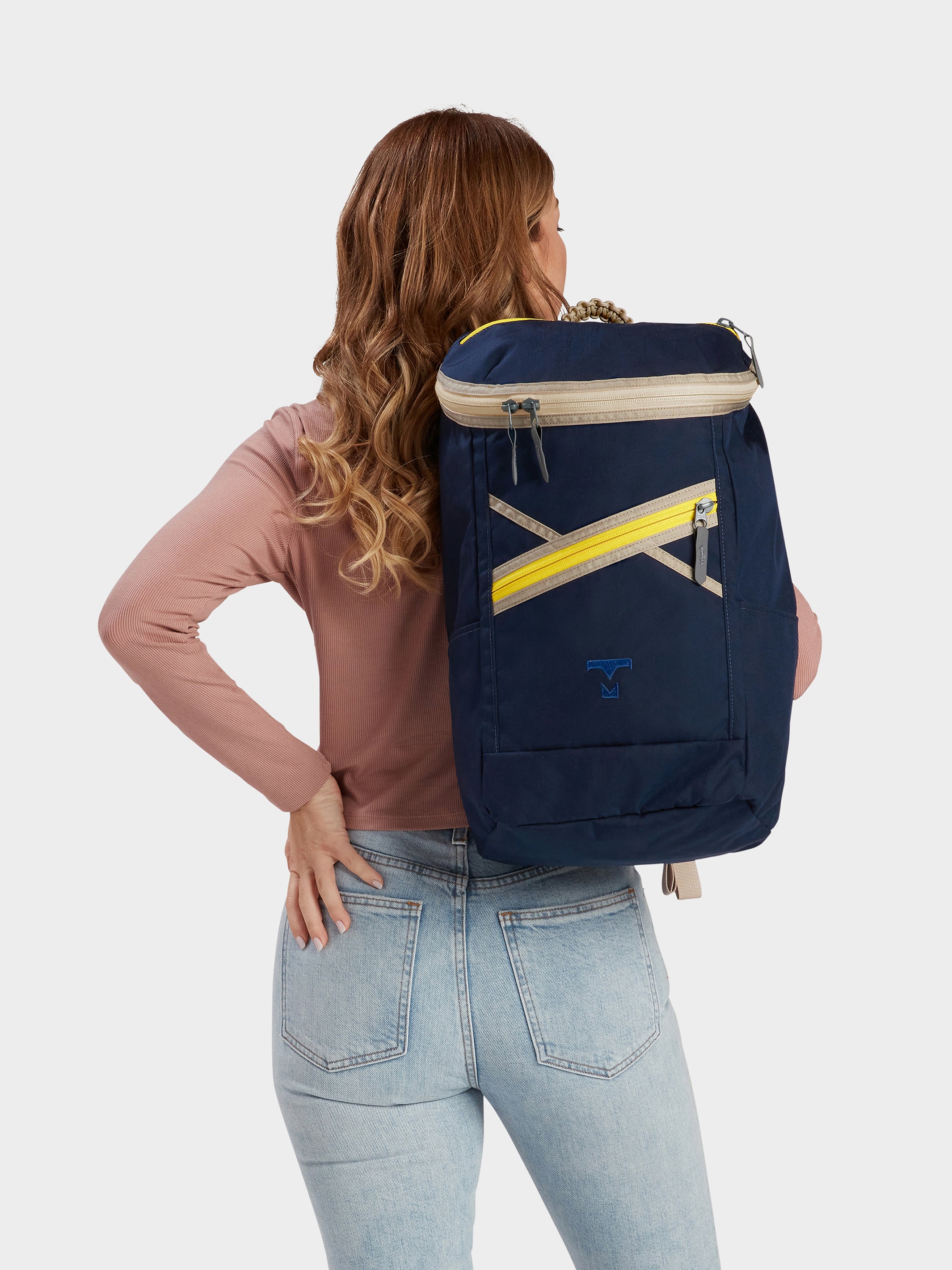 Bold backpack in midnight carried by model