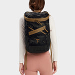 Bold backpack in multicam black carried by model