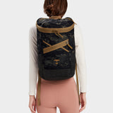 Bold backpack in multicam black carried by model