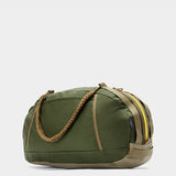 Grit duffle in camo green tabletop in back 45 degree view