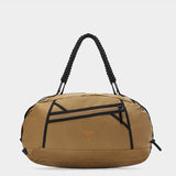 Grit duffle in coyote brown tabletop in front view