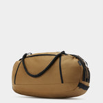 Grit duffle in coyote brown tabletop in back 45 degree view