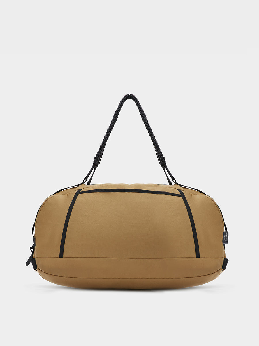 Grit duffle in coyote brown tabletop in back view