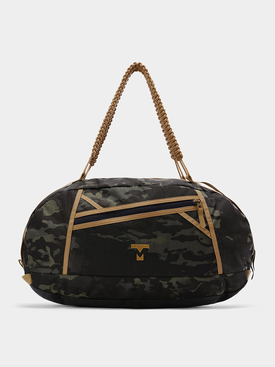 Grit duffle in multicam black tabletop in front view