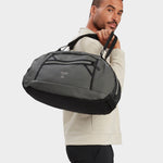 Grit duffle in foliage carried by model