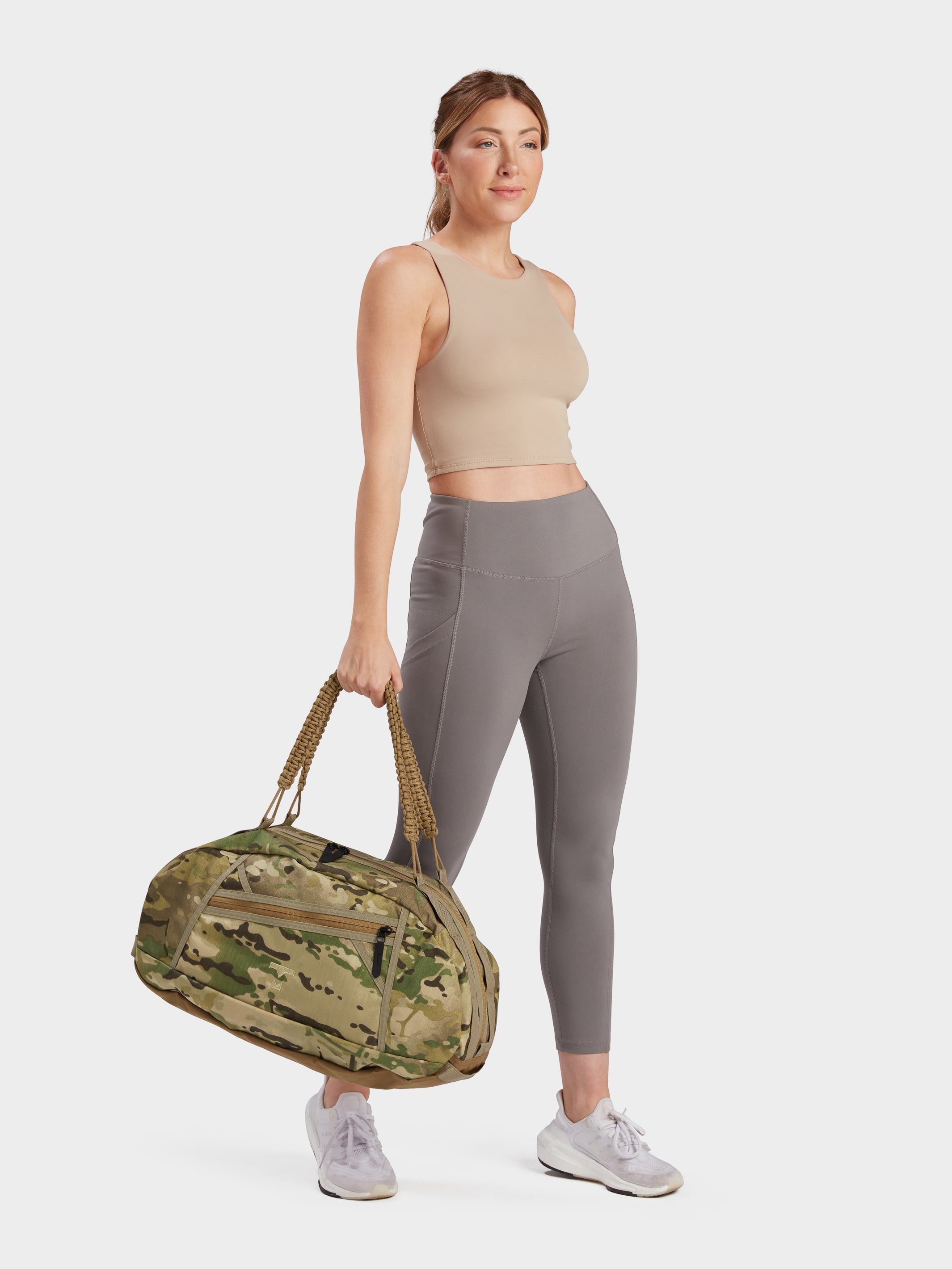 Grit duffle in multicam carried by model