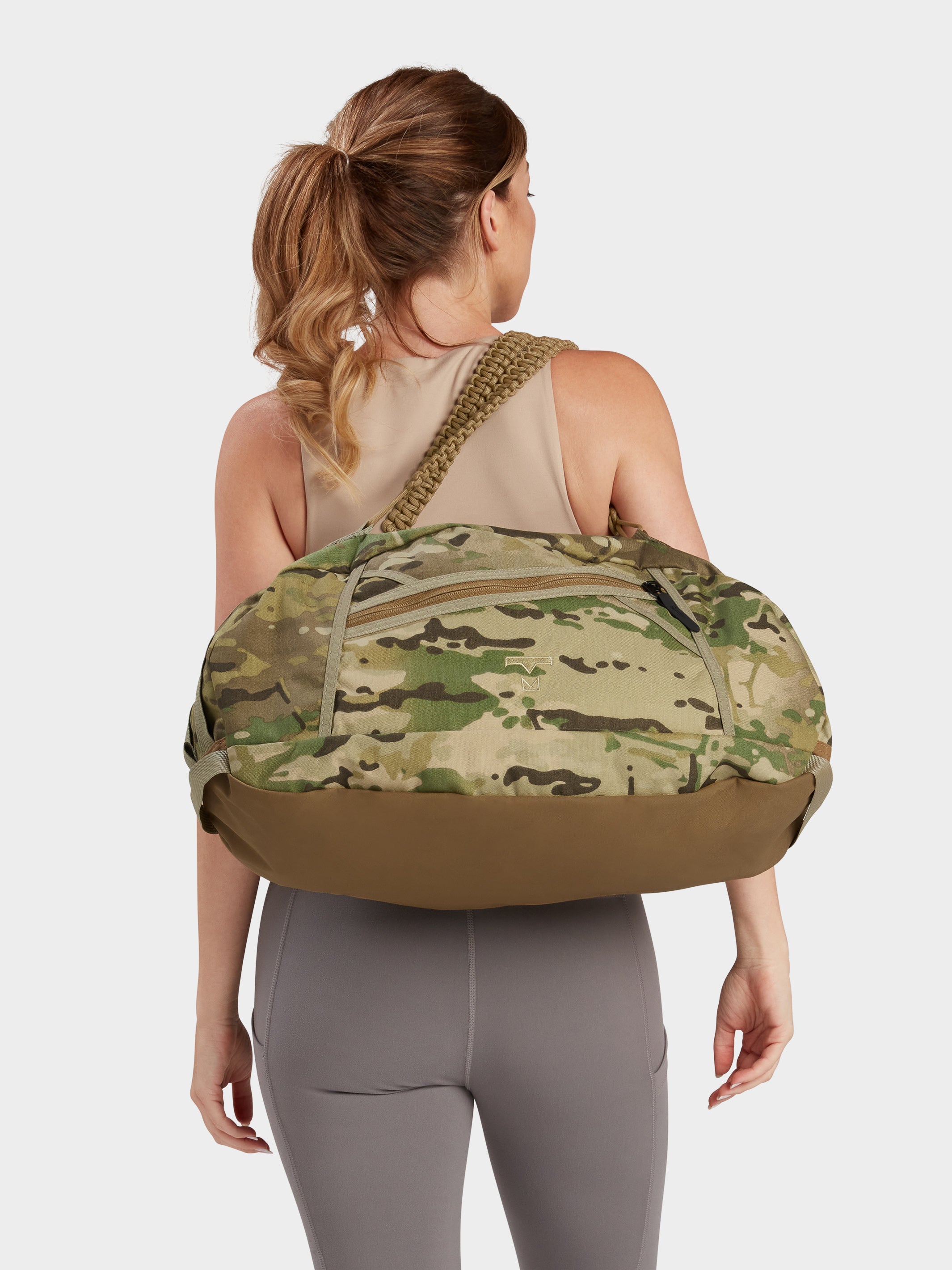 Grit duffle in multicam carried by model