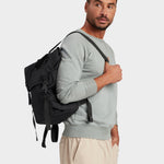 Swift backpack in black carried by model