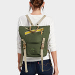 Swift backpack in camo green carried by model