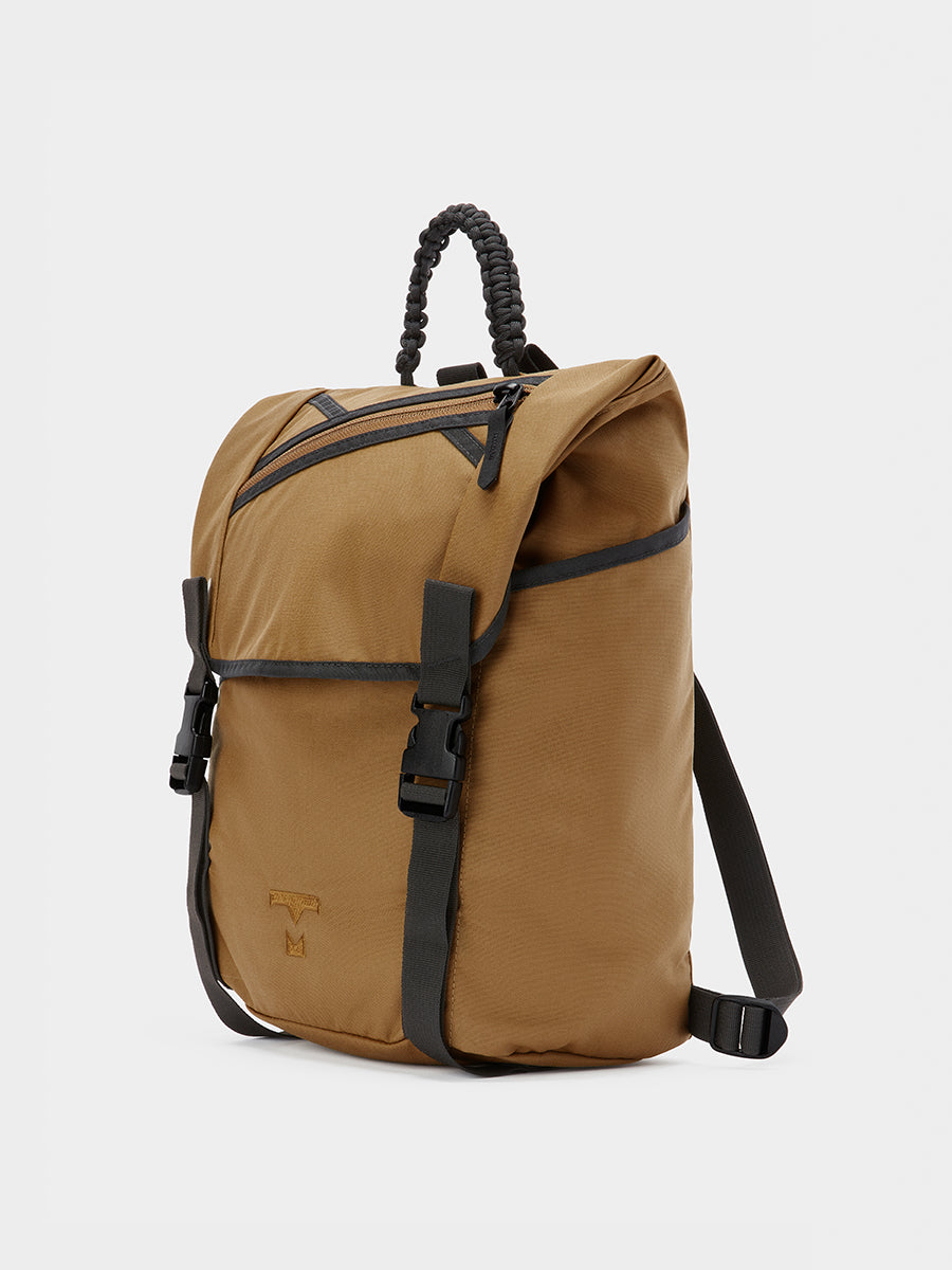 Swift backpack in coyote brown tabletop front 45 degree view