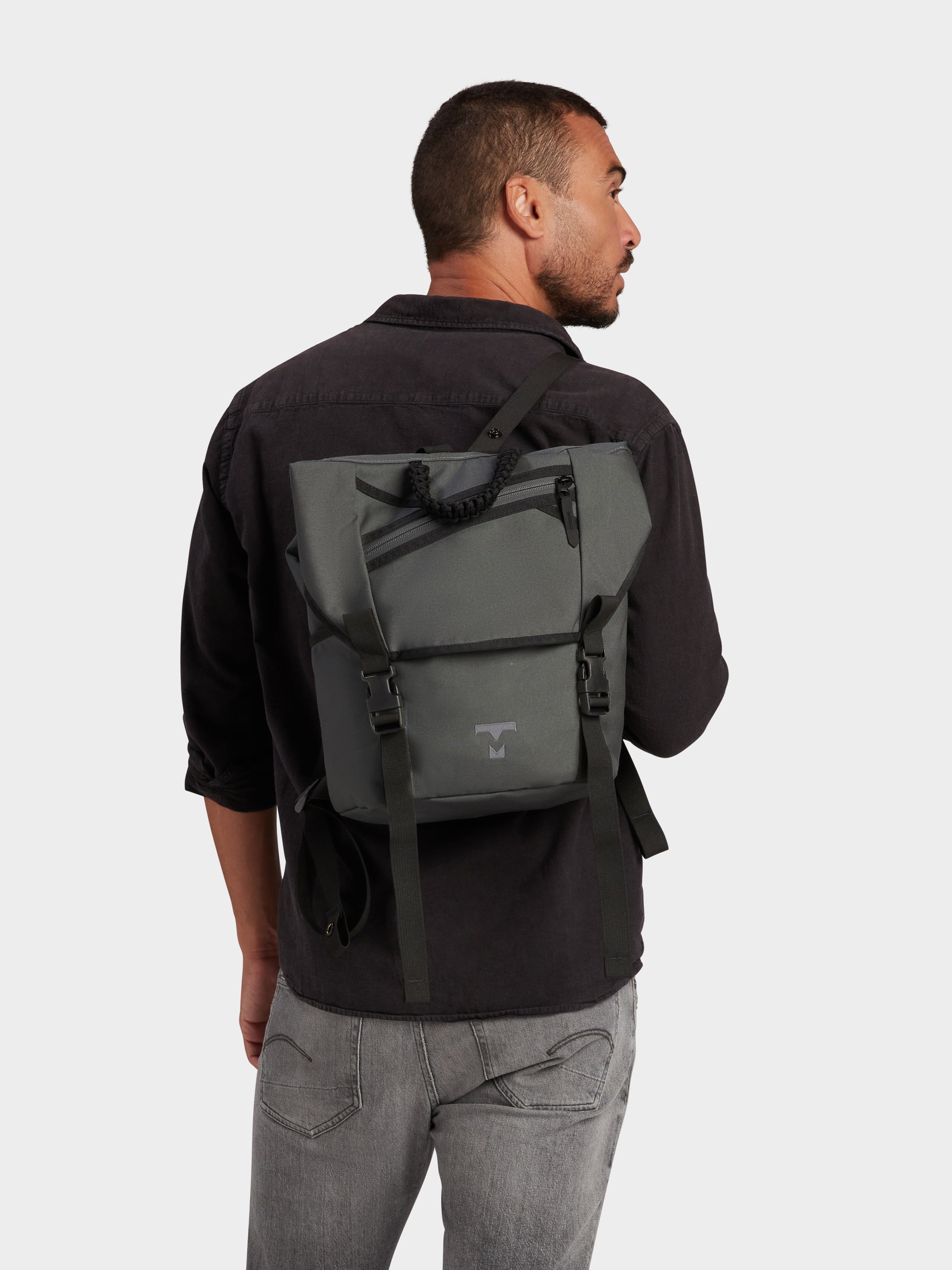 Swift backpack in foliage carried by model