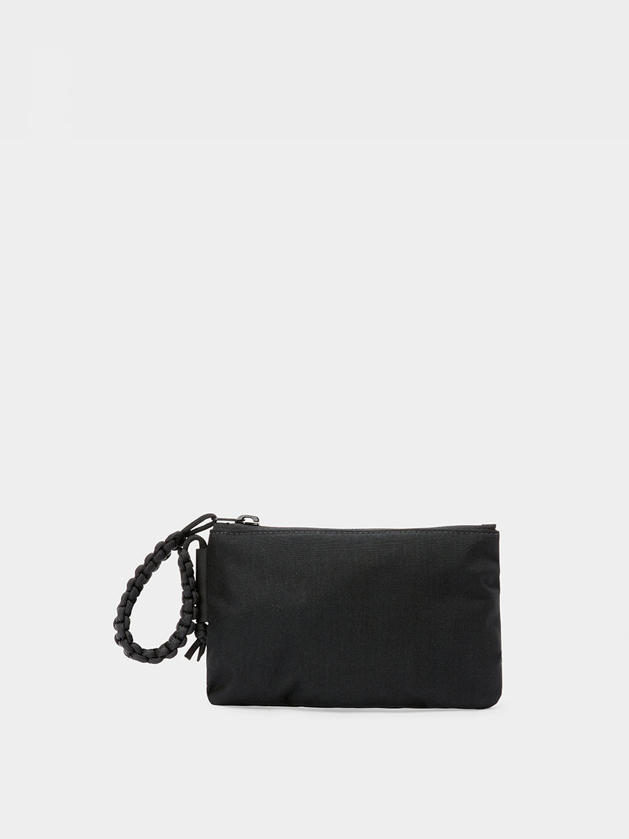 Zest wristlet in black tabletop back view