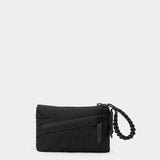 Zest wristlet in black tabletop front view