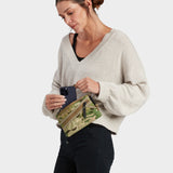 Zest wristlet in multicam carried by model