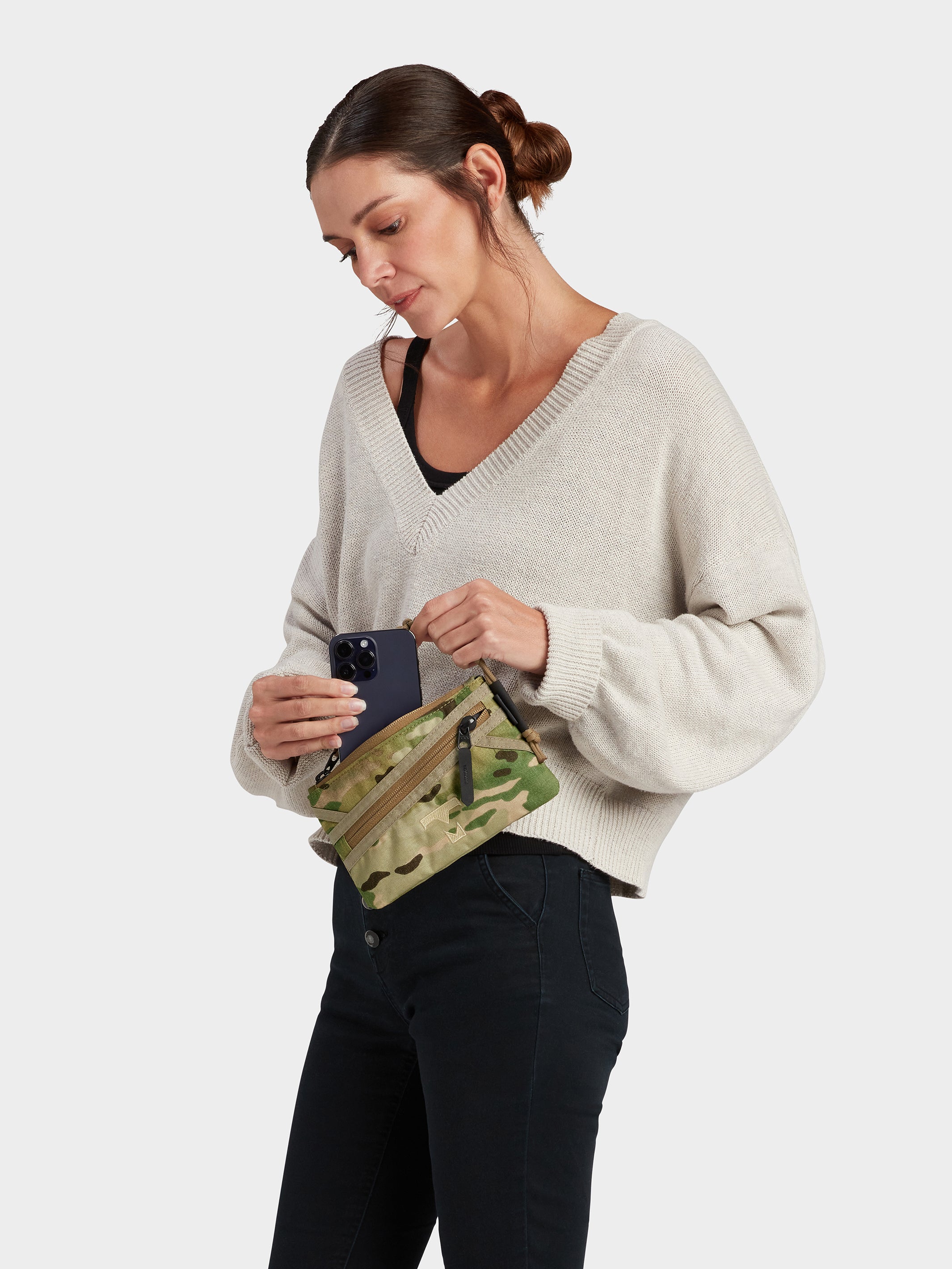 Zest wristlet in multicam carried by model