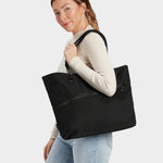 Zing tote in black carried by model