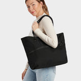 Zing tote in black carried by model