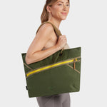 Zing tote in camo green carried by model