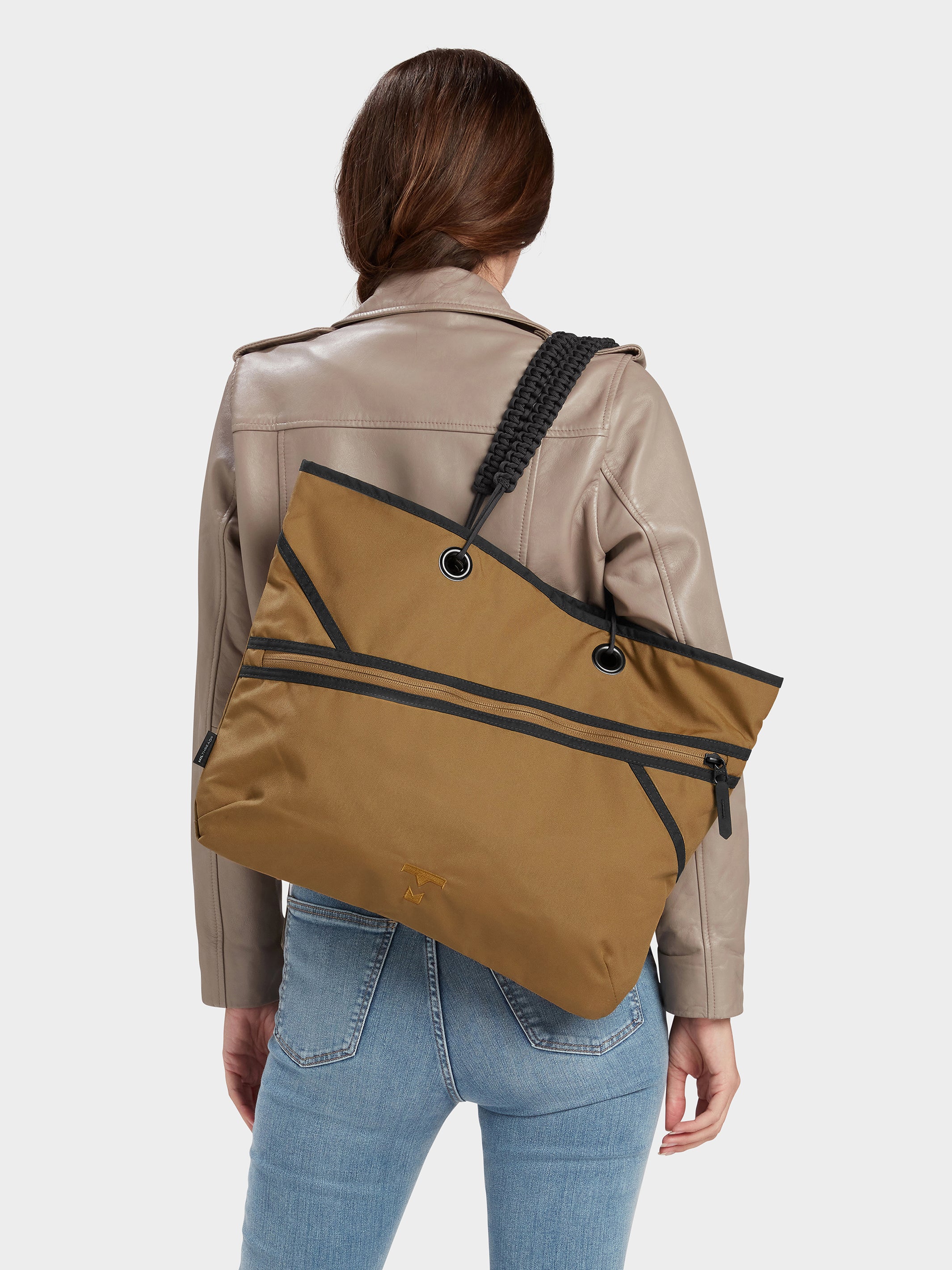 Zing tote in coyote brown carried by model