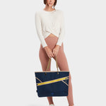 Zing tote in midnight carried by model