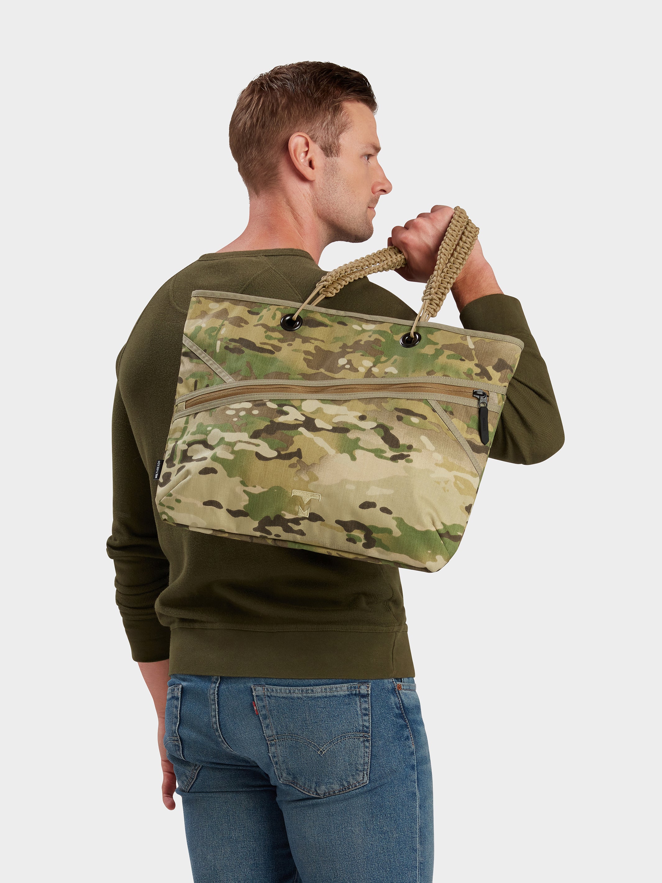 Zing tote in multicam carried by model